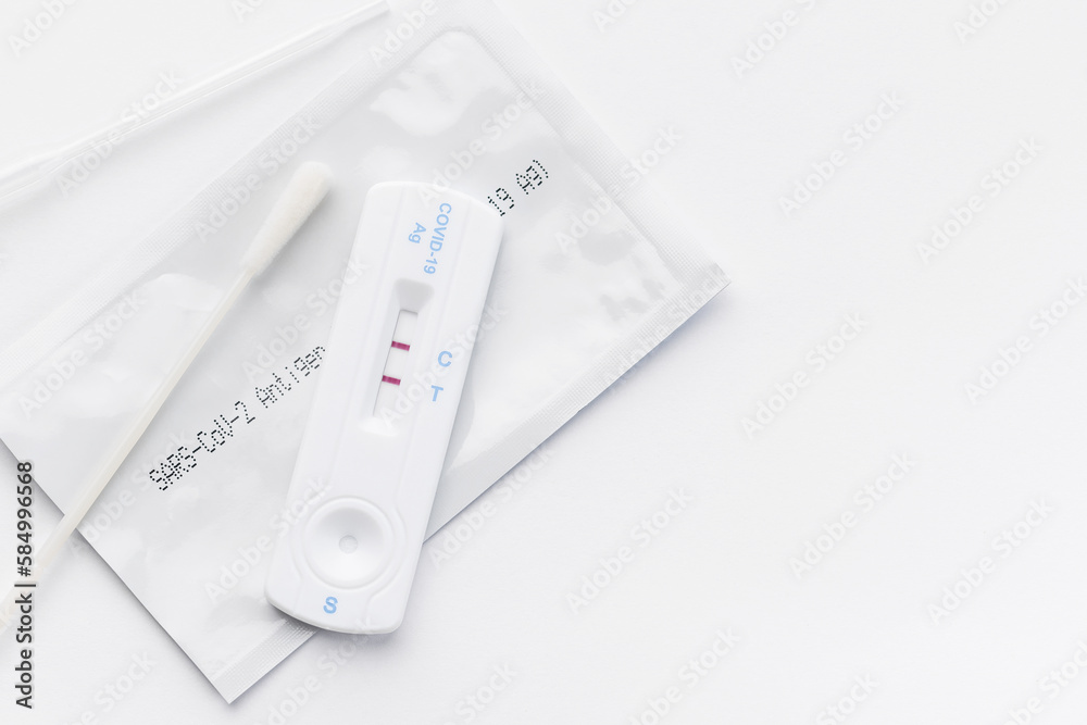 Home testing kit for coronavirus on a white background Home testing kit for coronavirus on a white background