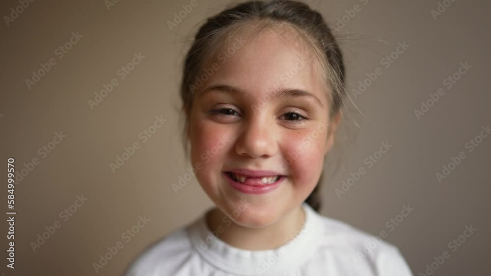 Happy face of European girl. child's milk teeth fall out, without baby's toothless smile. girl laughs happily and looks into camera. Problems with milk teeth. Dentist for child. Happy face of European girl. child's milk teeth fall out, without baby's toothless smile. girl laughs happily and looks into camera. Problems with milk teeth. Dentist for child.