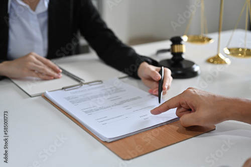 Female lawyer discussing  contract or legal papers client. Law services concept. contract document.