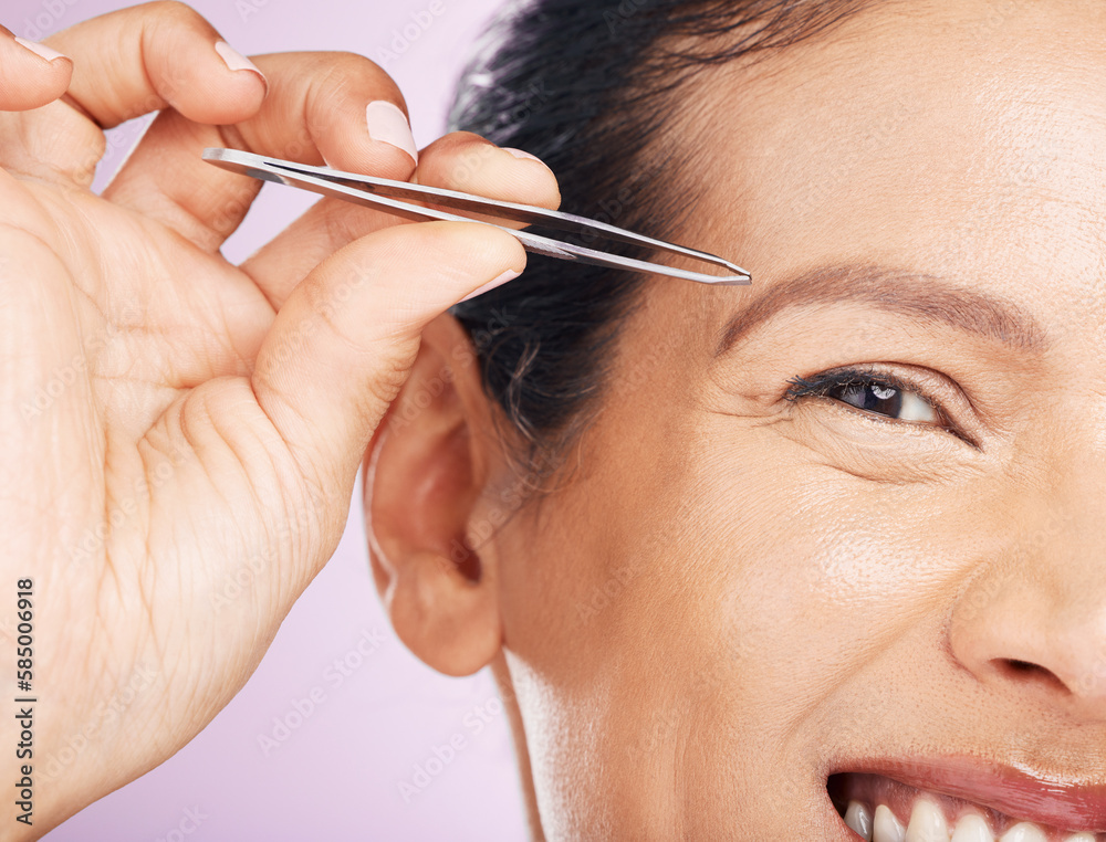 Woman with tweezers for plucking eyebrows in studio for mature facial hair removal routine. Self care, grooming and closeup of female model tweezing for face epilation treatment by purple background.