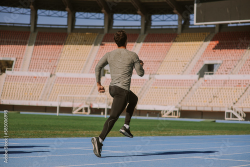 Sports guy sprinting at the stadium