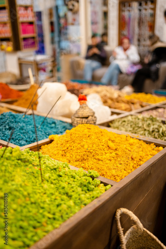 Colorful spices for sale in a market photo