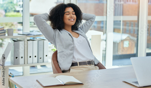Happy business woman stretching at desk for relax, career success and work life balance in her office. Professional worker or biracial person calm, confident and peace for project time management