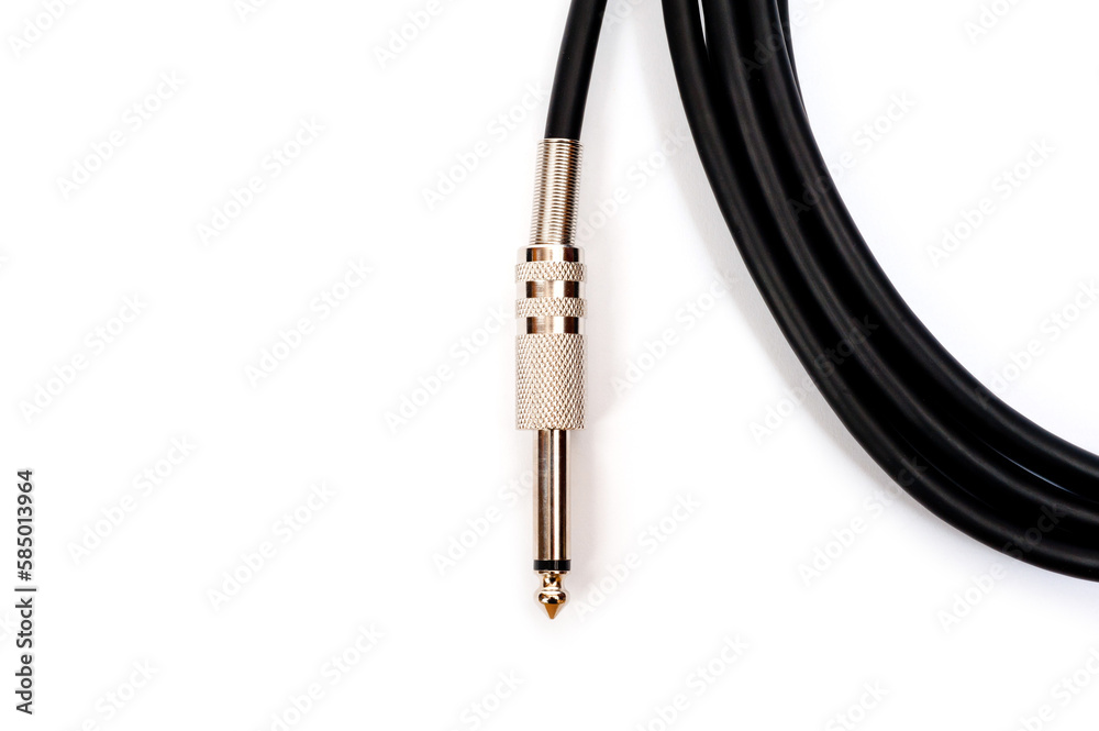 Long black jack cord for electric guitar, filmed on a white background.