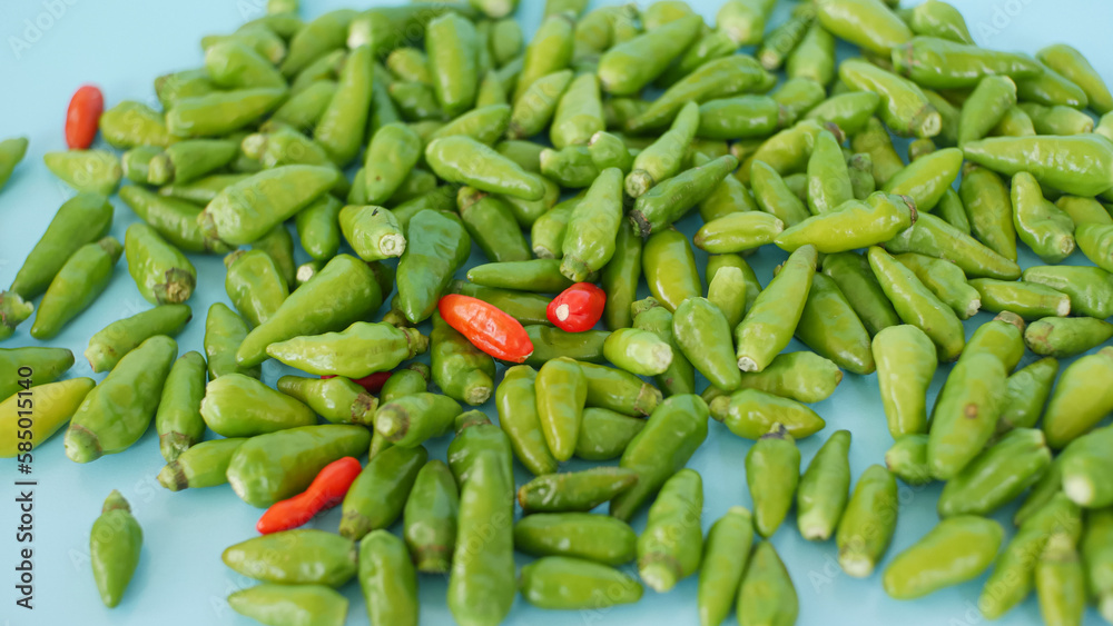 pile of green cayenne pepper pile of green cayenne pepper