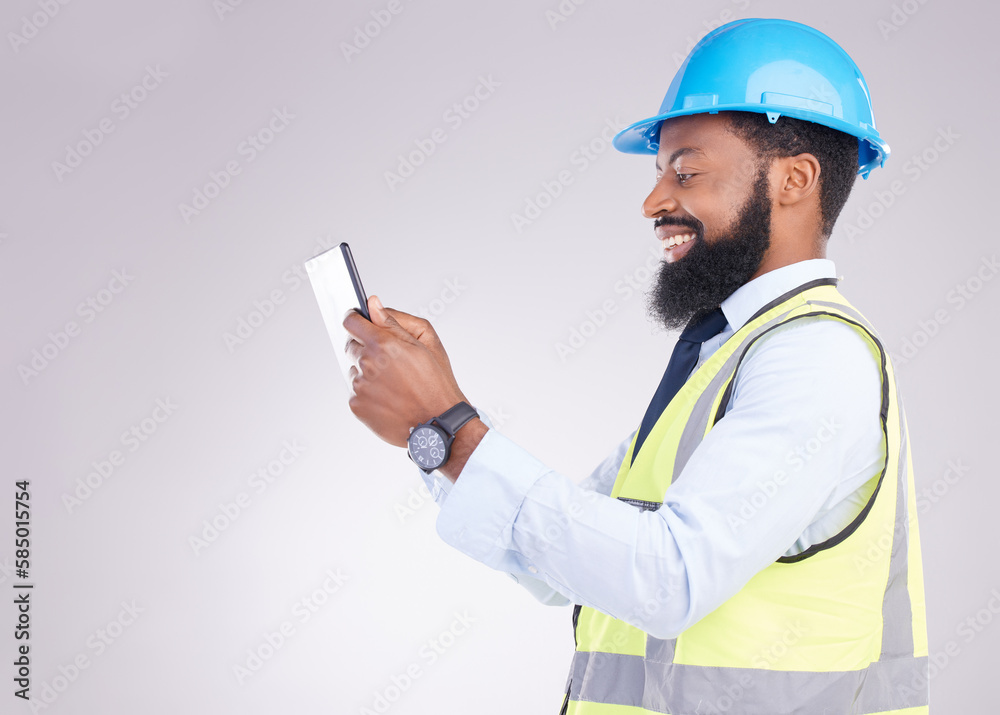 Tablet, construction and building with an engineer black man in studio on gray background for architecture. Internet, research and project management with a male handyman or contractor in engineering Tablet, construction and building with an engineer black man in studio on gray background for architecture. Internet, research and project management with a male handyman or contractor in engineering