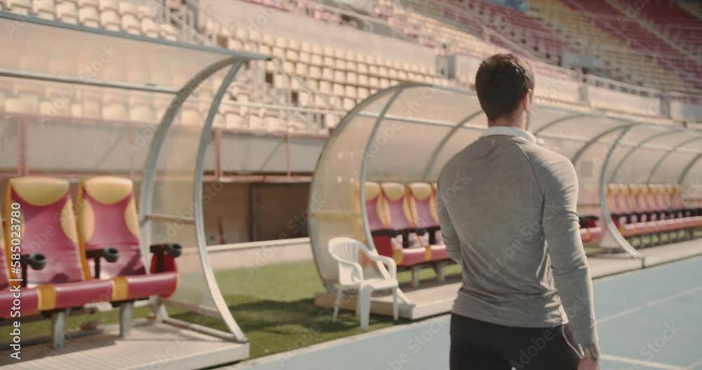 man walking at the stadium