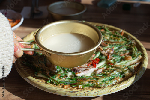 Korean seafood pancake Jeon with makgeolli