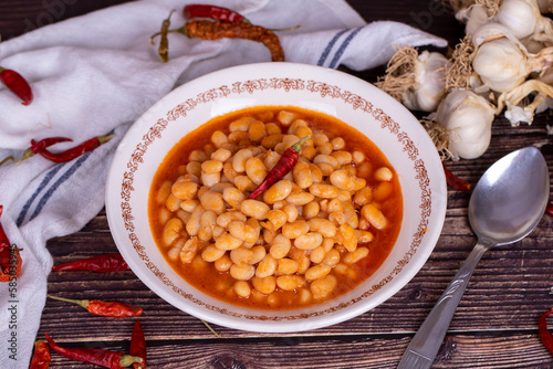 Dry bean meal. Dry bean dish in plate on wooden floor. Local name kuru fasulye. Close up