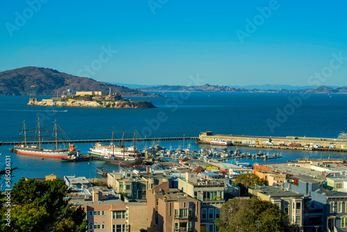 Cityscape at fisherman's worf in downtown coastal san francisco california with alcatraz island in background
