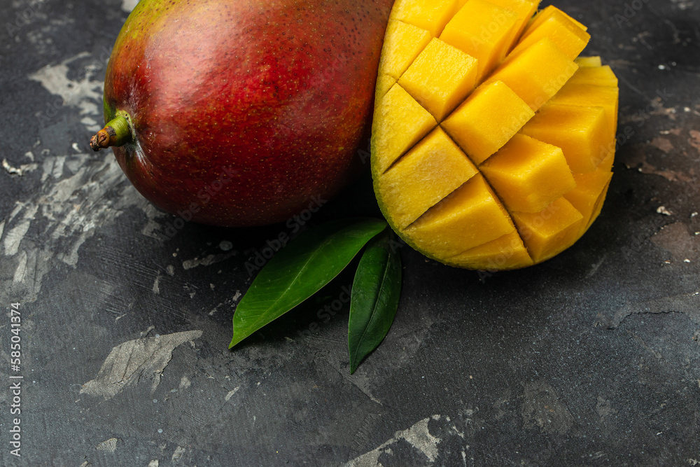 red mango. Fresh tropical fruit on a dark background. Long banner format red mango. Fresh tropical fruit on a dark background. Long banner format