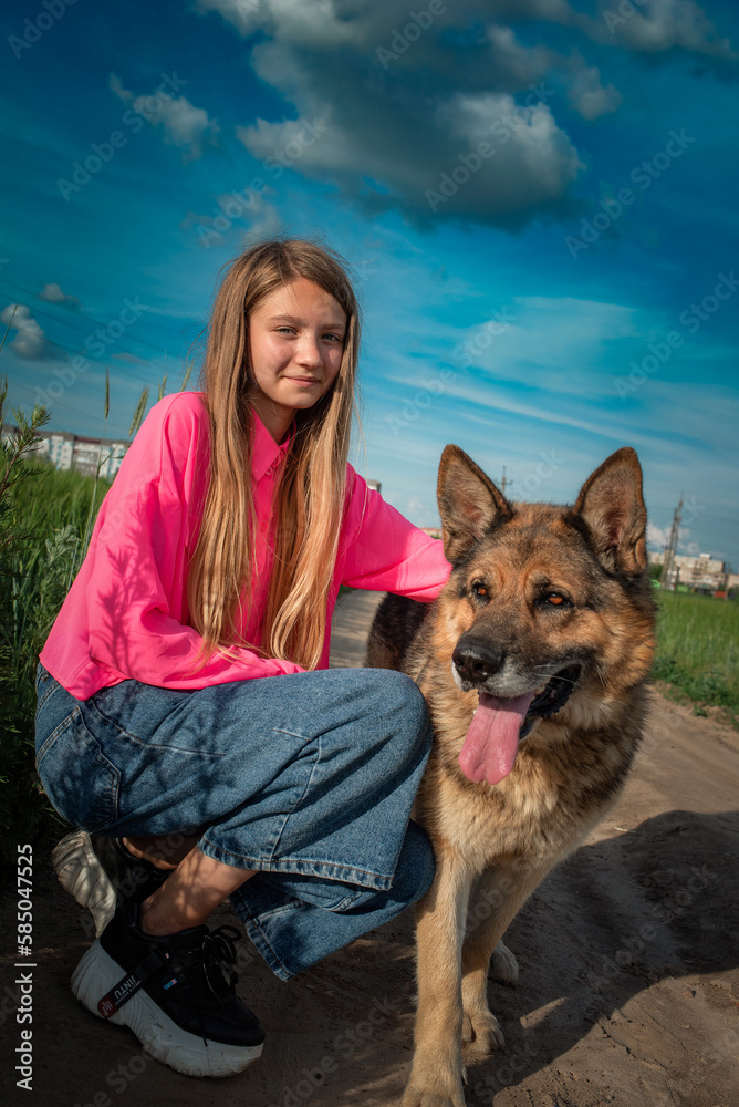 Portrait of a young beautiful long-haired girl with a dog. Portrait of a young beautiful long-haired girl with a dog.