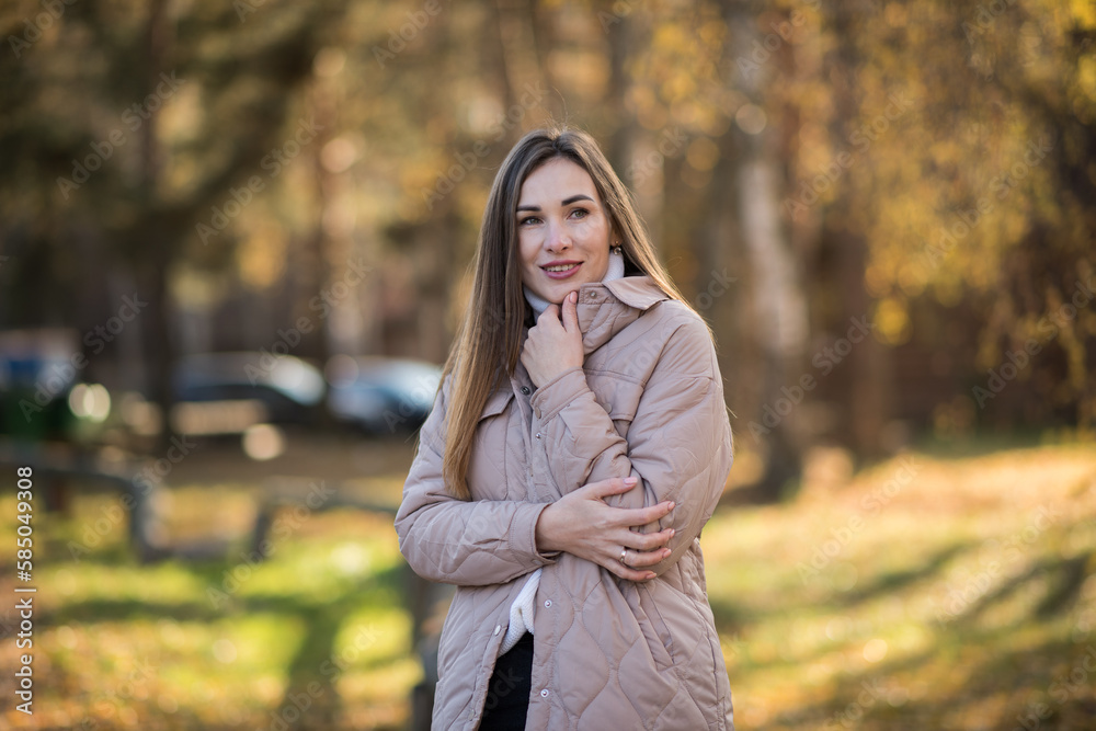 girl with long hair in the autumn park, portrait of a brunette on an autumn sunny day girl with long hair in the autumn park, portrait of a brunette on an autumn sunny day