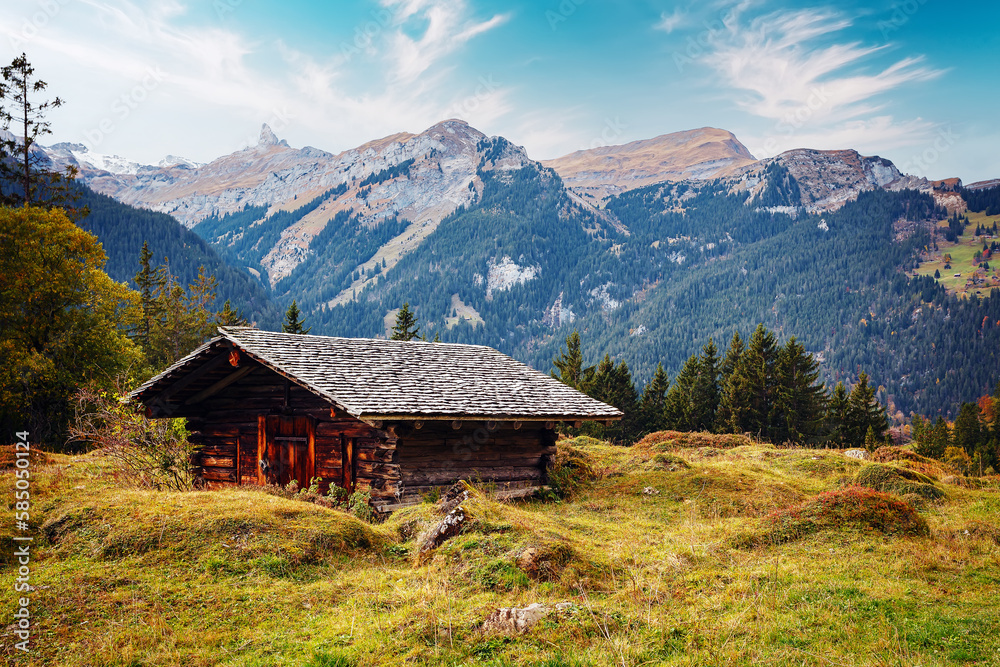 Wonderful view of scenic mountain landscape in the Alps with traditional old mountain hut on highland. Amazing Nature Landscape. Awesome natural Background. Incredible colorful Scenery.