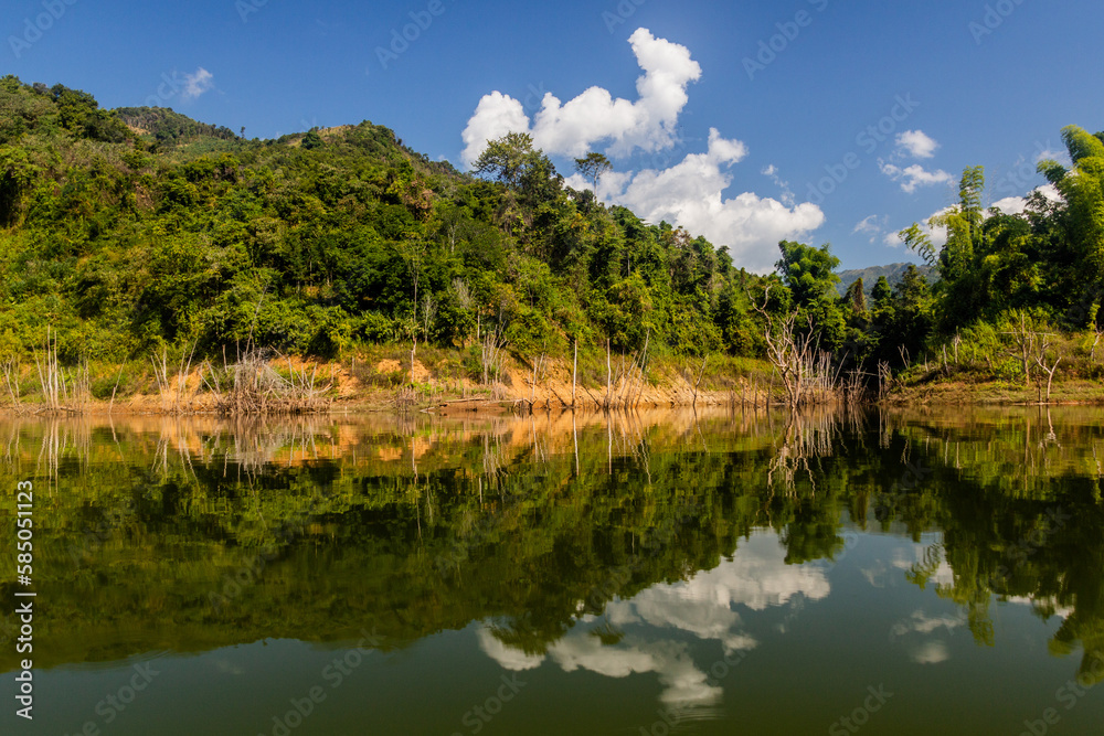Reflections in waters of Nam Ou 5 reservoir, Laos Reflections in waters of Nam Ou 5 reservoir, Laos