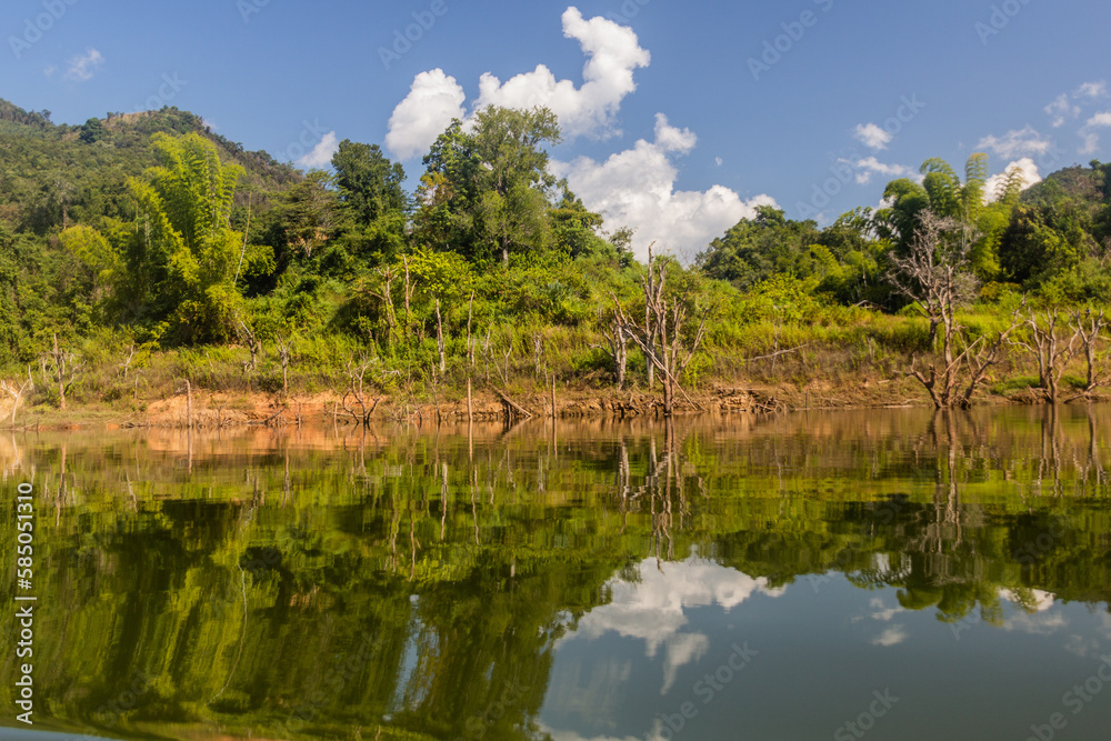 Reflections in waters of Nam Ou 5 reservoir, Laos