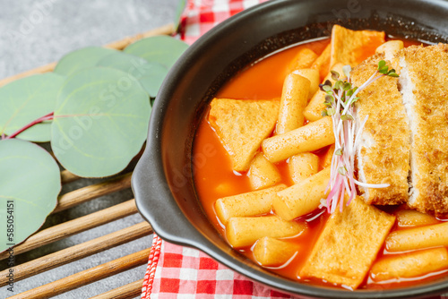 Tteokbokki, Stir-fried Rice Cake : Sliced rice cake bar (garaetteok) or thin rice cake sticks (Tteokbokkitteok) stir-fried in a spicy gochujang sauce with vegetables and fish cakes. photo