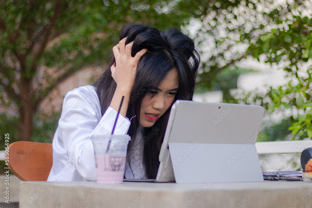 beautiful asian women formal explore cafe outdoor. girl stress unfinished work in front of tablet laptop in cafe oudoor beautiful asian women formal explore cafe outdoor. girl stress unfinished work in front of tablet laptop in cafe oudoor