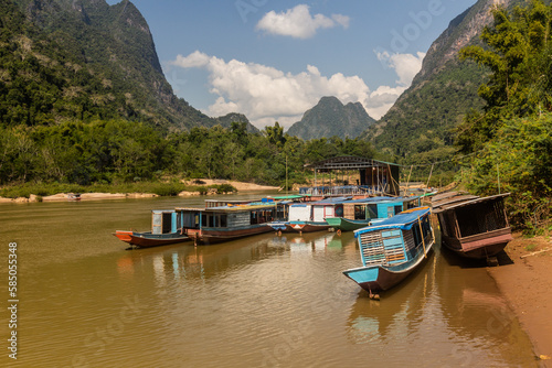 Boats at Nam Ou river in Muang Ngoi Neua village, Laos