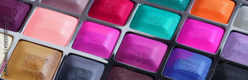 Photo Illustration of an array of colorful eyeshadows in a makeup palette created with