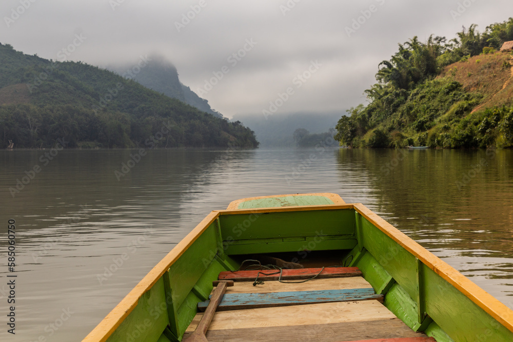 Boat travelling on Nam Ou river, Laos