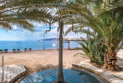 Shower on sandy beach of the Red Sea in Eilat - famous tourist resort and rec...