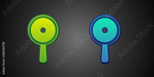 Green and blue Frying pan icon isolated on black background. Fry or roast food symbol. Vector