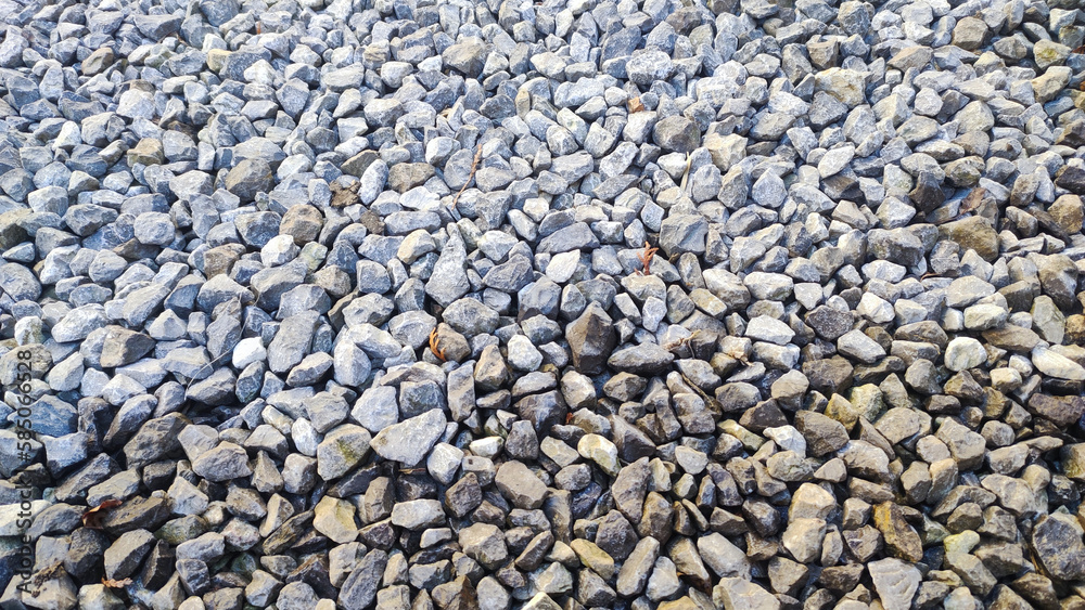 Gravel road stone texture. Gray gravel pattern. Closeup road with small rocks background Gravel road stone texture. Gray gravel pattern. Closeup road with small rocks background