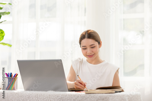 Asian Business woman writing down requirement and ideas to book for planing Business Startup,Feeling so happiness and working with positive emotional,Small Business Startup Concept Free Download Asian Business woman writing down requirement and ideas to book for planing Business Startup,Feeling so happiness and working with positive emotional,Small Business Startup Concept - GFXLoad