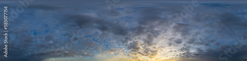 Panorama of a dark blue sunset sky with golden Cumulus clouds. Seamless hdr 360 panorama in spherical equiangular format. Full zenith for 3D visualization, sky replacement for aerial drone panoramas.