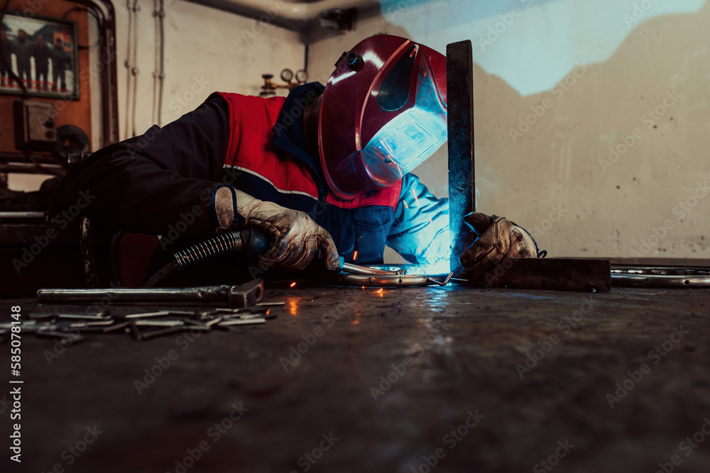 Obraz premium Welder erecting technical steel. Industrial steel welder in factory technical