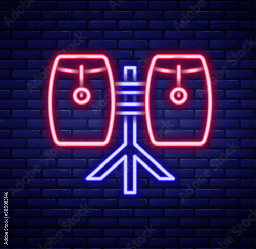 Glowing neon line Conga drums icon isolated on brick wall background. Musical instrument. Colorful outline concept. Vector