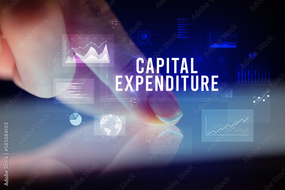 Finger touching tablet with business graphs and icons concept Finger touching tablet with business graphs and icons concept