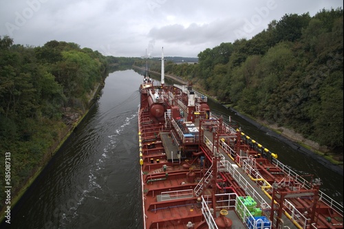 Tanker vessel sailing narrow river