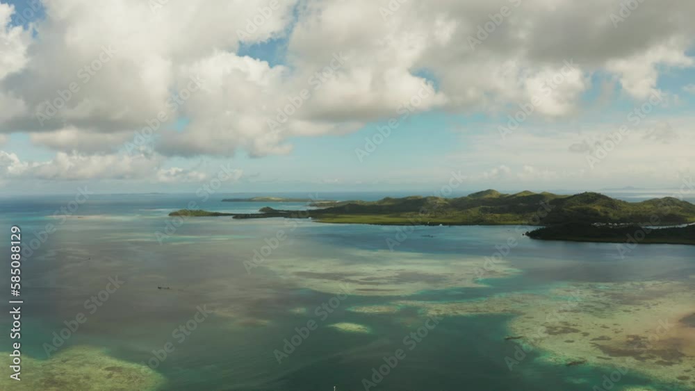 Tropical islands in turquoise lagoon and coral reef water, aerial view. Bucas grande, Philippines. Summer and travel vacation concept. Tropical islands in turquoise lagoon and coral reef water, aerial view. Bucas grande, Philippines. Summer and travel vacation concept.