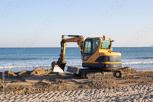 Beach renovation with heavy excavator machine