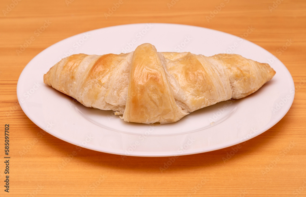 Butter croissant on plate