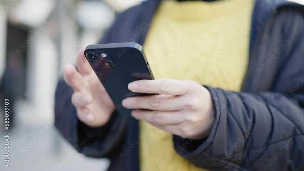 Young chinese woman using smartphone at street Young chinese woman using smartphone at street