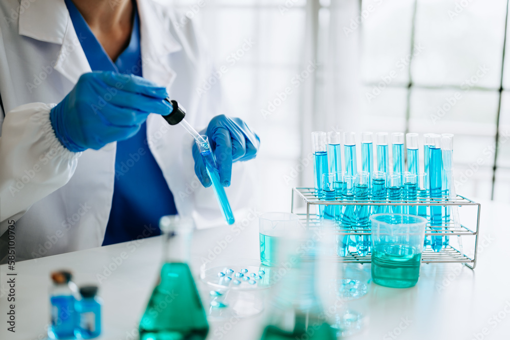 Female scientist researcher conducting an experiment working in the laboratory Female scientist researcher conducting an experiment working in the laboratory