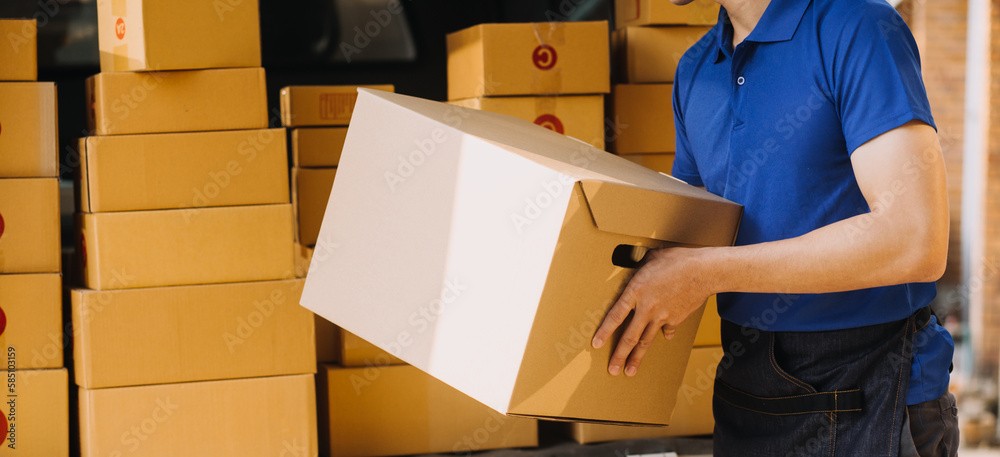 Asian business men use laptop computer checking customer order online shipping boxes at home. Starting Small business entrepreneur SME freelance Asian business men use laptop computer checking customer order online shipping boxes at home. Starting Small business entrepreneur SME freelance
