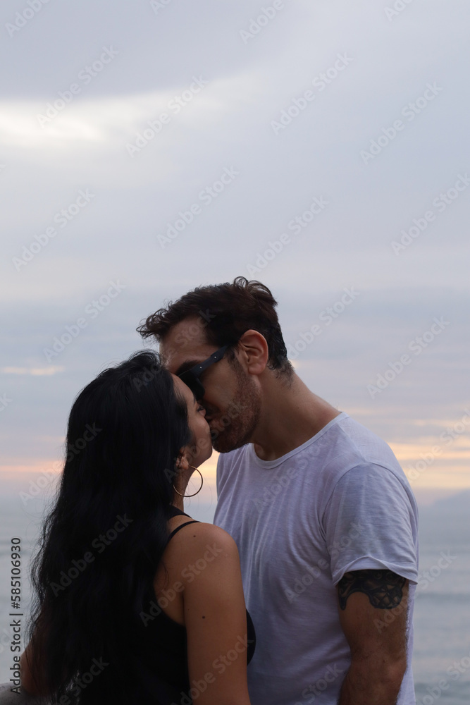 photo of couple kissing in summer. Concept of couples. photo of couple kissing in summer. Concept of couples.