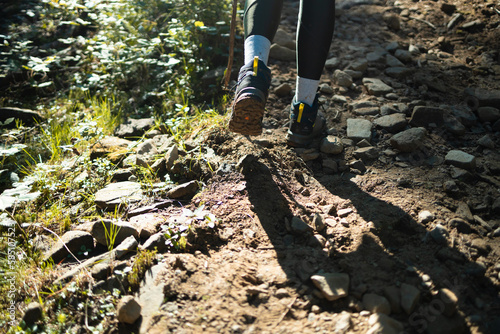 Hiking boot. Walk on trekking trail in forest. Leather ankle boots