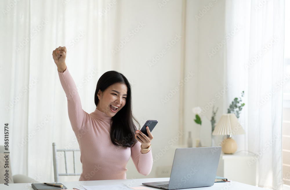 Young pretty Asian woman impressed with a good news, raised fists scream yes, celebrating success on her own. Young pretty Asian woman impressed with a good news, raised fists scream yes, celebrating success on her own.