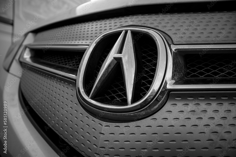 Acura logo on the front of the car. Acura emblem on the front bumper of ...