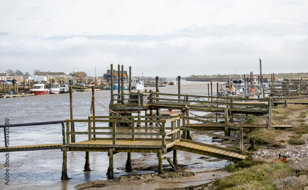 Wooden staging, piers and jetties  on the River Blyth in Walberswick on the Suffolk coast