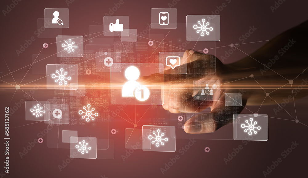 Hand pressing social media multimedia application screen with media icons on futuristic concept Hand pressing social media multimedia application screen with media icons on futuristic concept