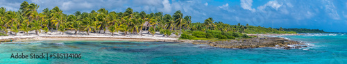 A panorama view along the beach and rocky shoreline beside the mexican resort of Costa Maya on the Yucatan peninsula on a sunny day