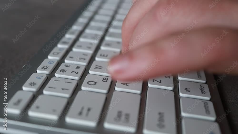 Close-up of male hands typing on keyboard indoors. Businessman working in office or student browsing information Close-up of male hands typing on keyboard indoors. Businessman working in office or student browsing information