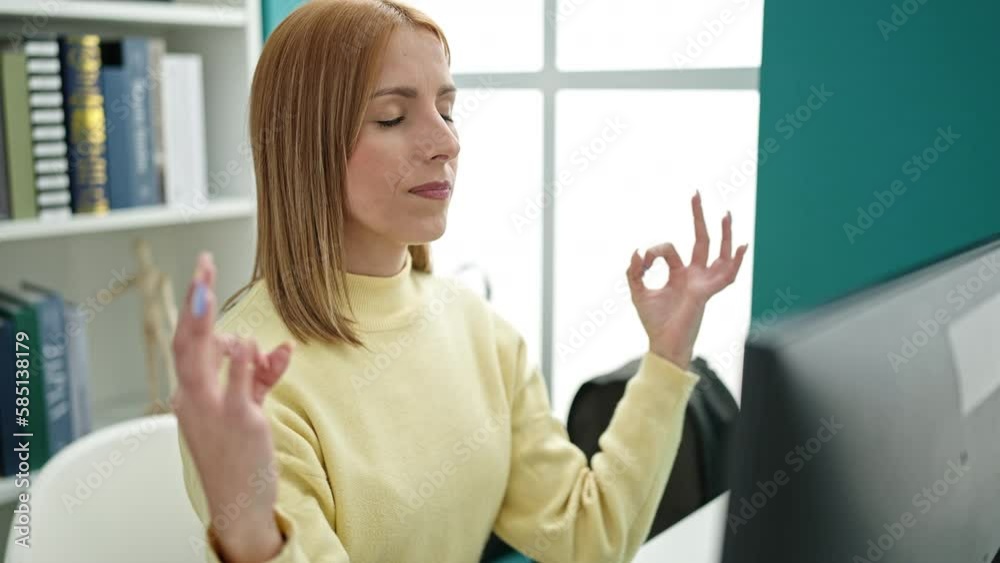 Young blonde woman student doing yoga exercise at university classroom Young blonde woman student doing yoga exercise at university classroom