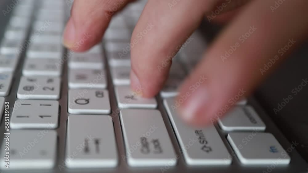 Close-up of male hands typing on keyboard indoors. Businessman working in office or student browsing information Close-up of male hands typing on keyboard indoors. Businessman working in office or student browsing information